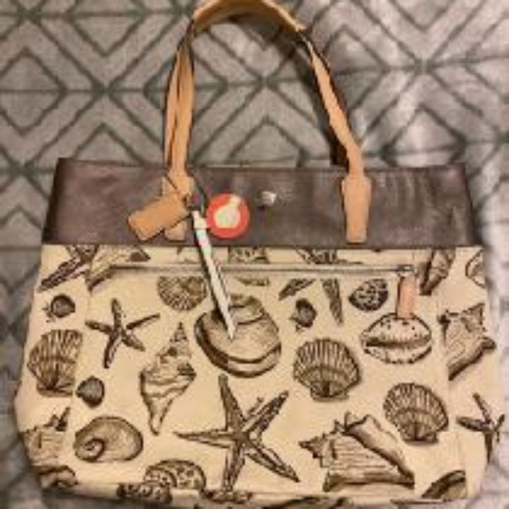 Coach 

Coach seashell bag with extra Coach key ri